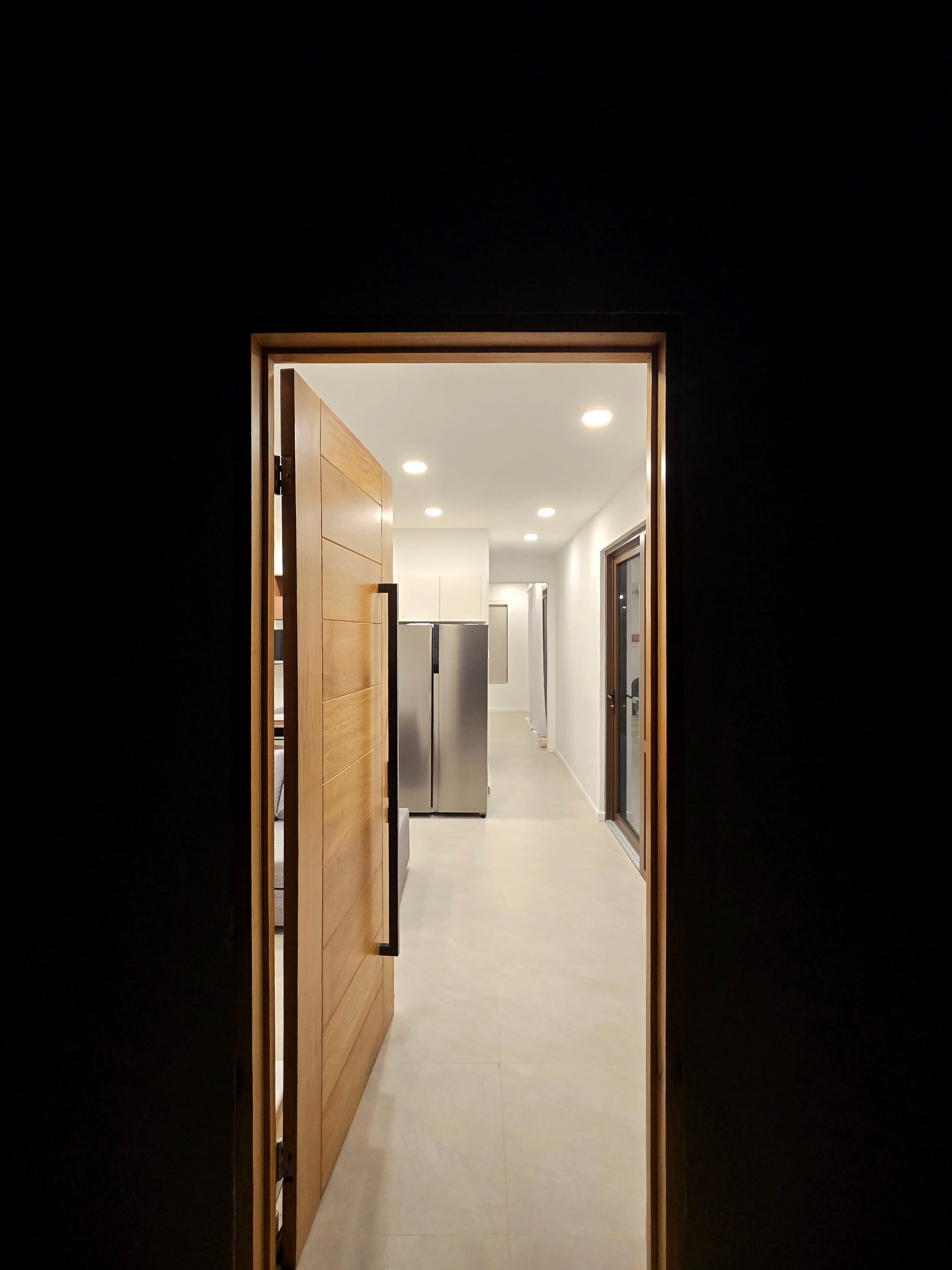 Aerial view of luxury villa with private pool surrounded by tropical palms
